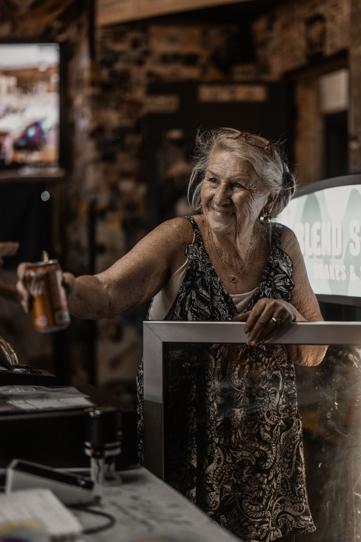 Cheers from behind the counter.