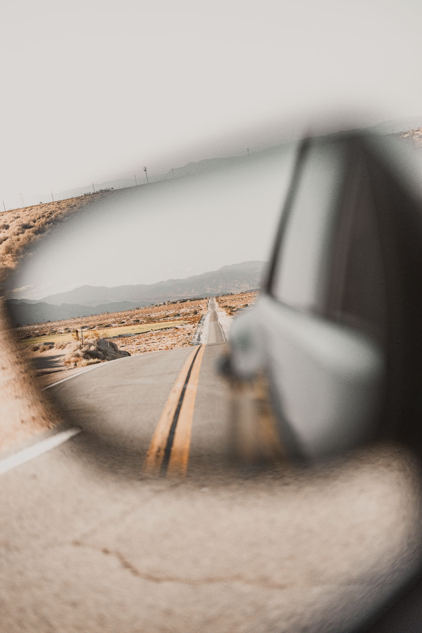 Route 66, in the side mirror.