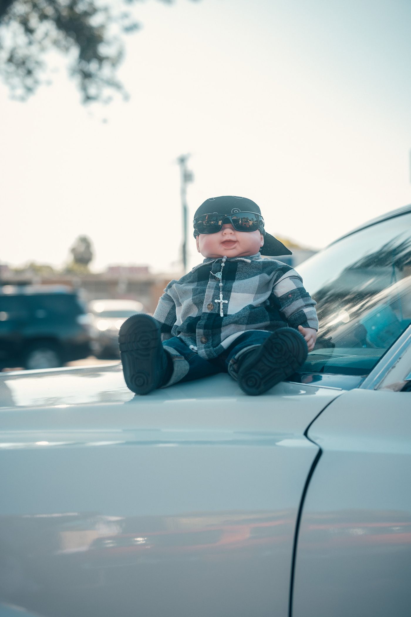 Riding on the hood.