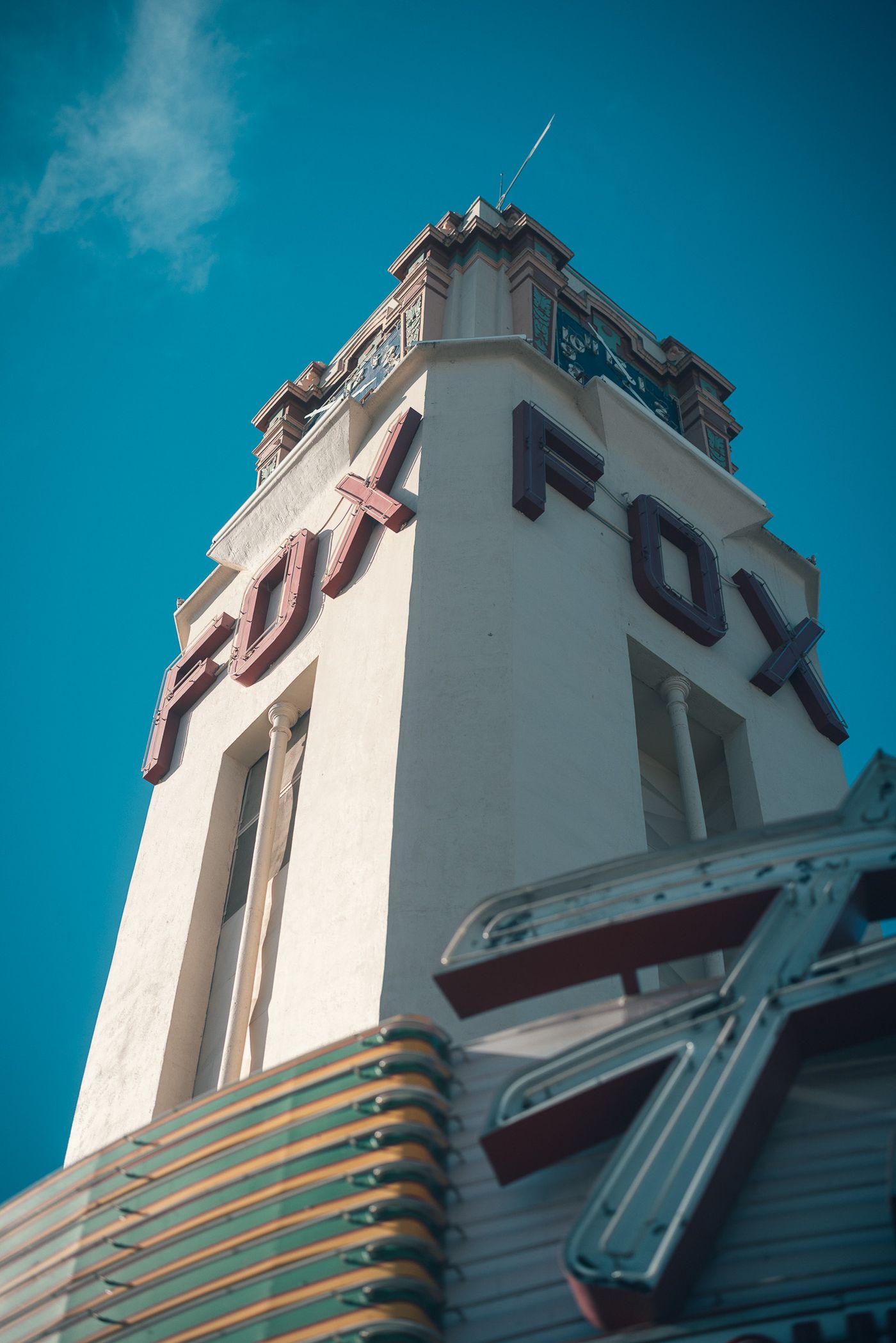 Red letters, white tower.